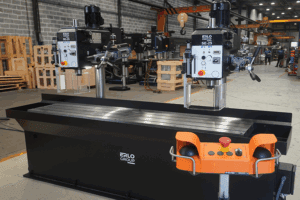 Erlo SE-25 dual-head gang drill with manual and automatic feed on shared T-slotted base in factory setting