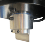 Piston end cap with integrated tool slot on hydraulic press for custom tools.