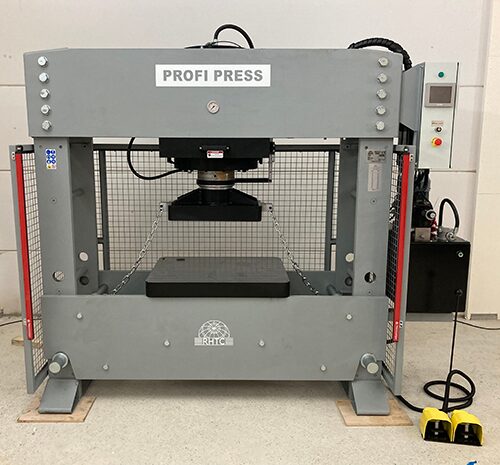 Frontal View 300-ton hydraulic press with light curtain photo cells and mesh side curtains for enhanced operator safety.