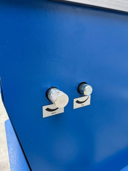 Manual adjustment valves on the PPC-100 for regulating hydraulic pressure and speed.